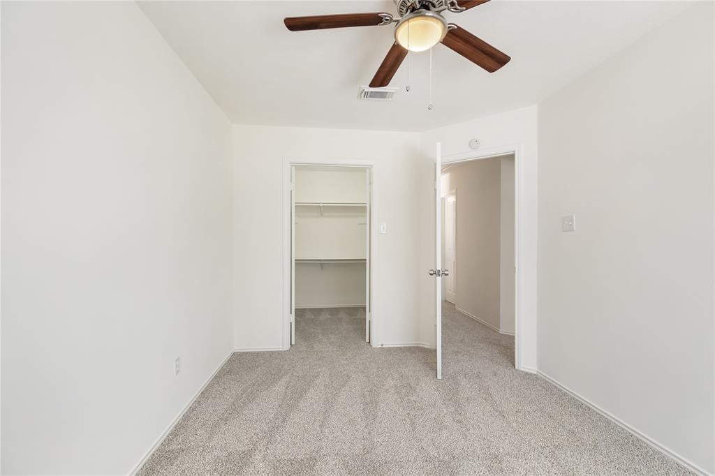 9410 Calwood Circle Spring, TX 77379 - Photo 17 of 34 a view of a room with a ceiling fan and window