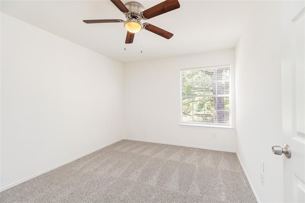 9410 Calwood Circle Spring, TX 77379 - Photo 20 of 34 an empty room with a window and a fan