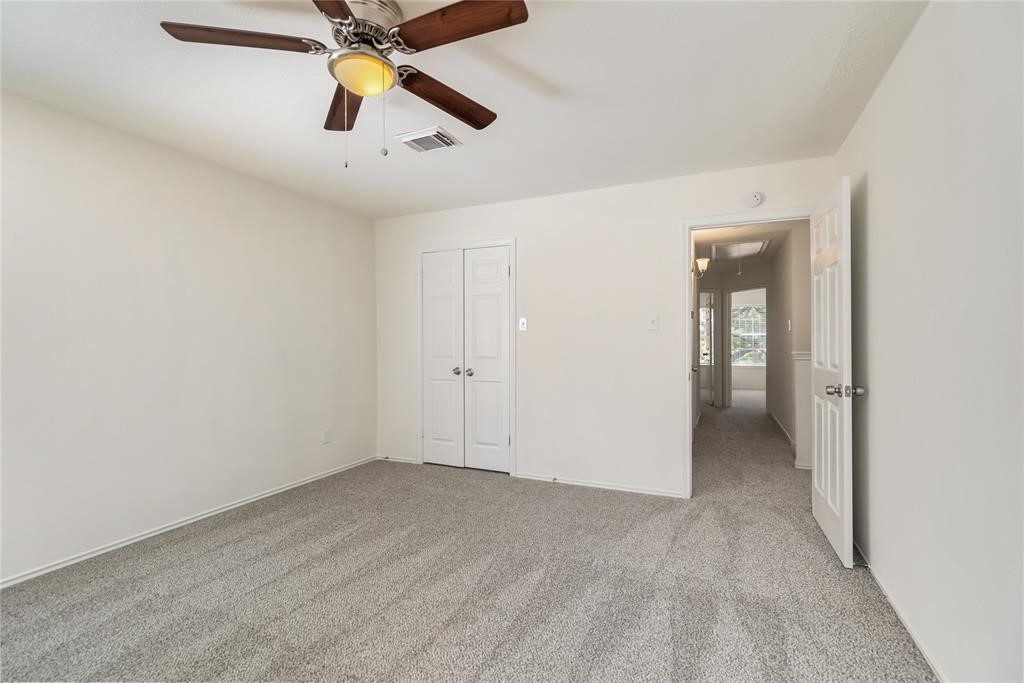 9410 Calwood Circle Spring, TX 77379 - Photo 22 of 34 an empty room with chandelier fan