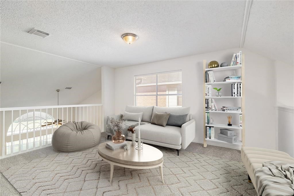 9410 Calwood Circle Spring, TX 77379 - Photo 28 of 34 a living room with furniture a rug and kitchen view