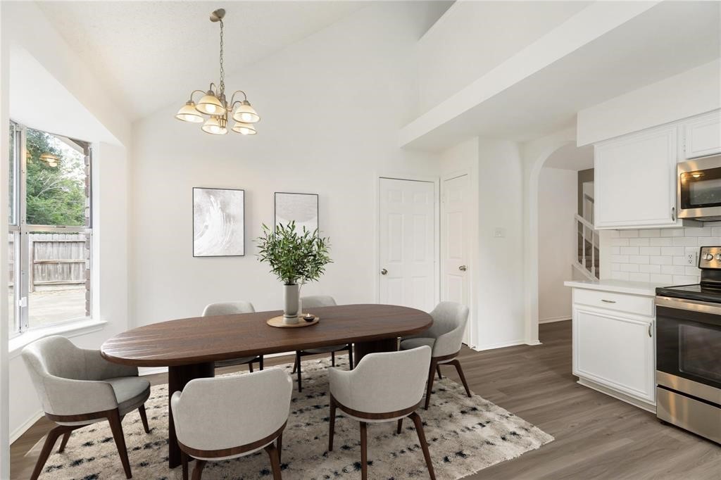 9410 Calwood Circle Spring, TX 77379 - Photo 10 of 34 a view of a dining room with furniture window and wooden floor