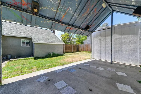 a view of backyard with garage