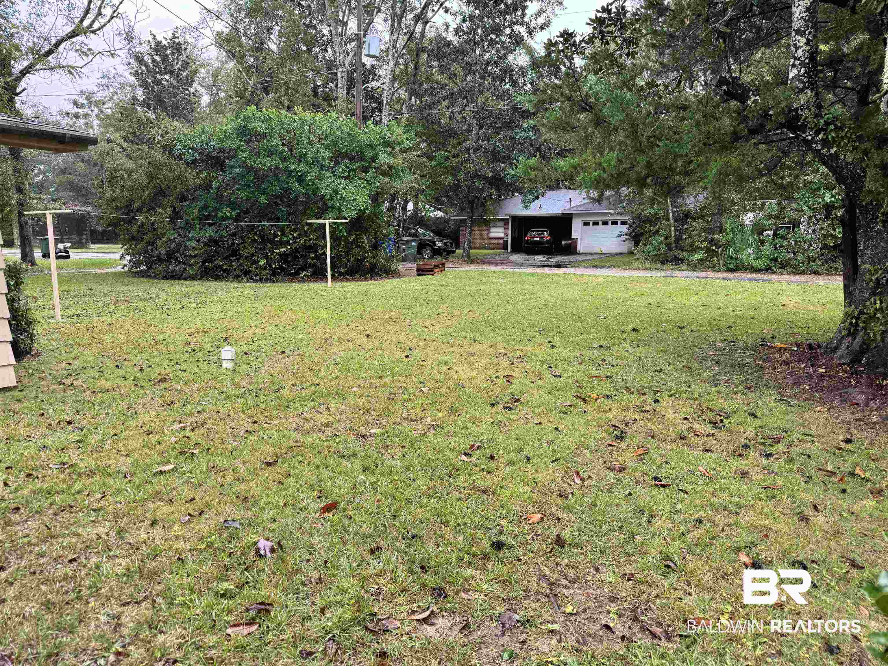 217 West Magnolia Avenue Foley, AL 36535 - Photo 20 of 21 View of yard featuring a garage