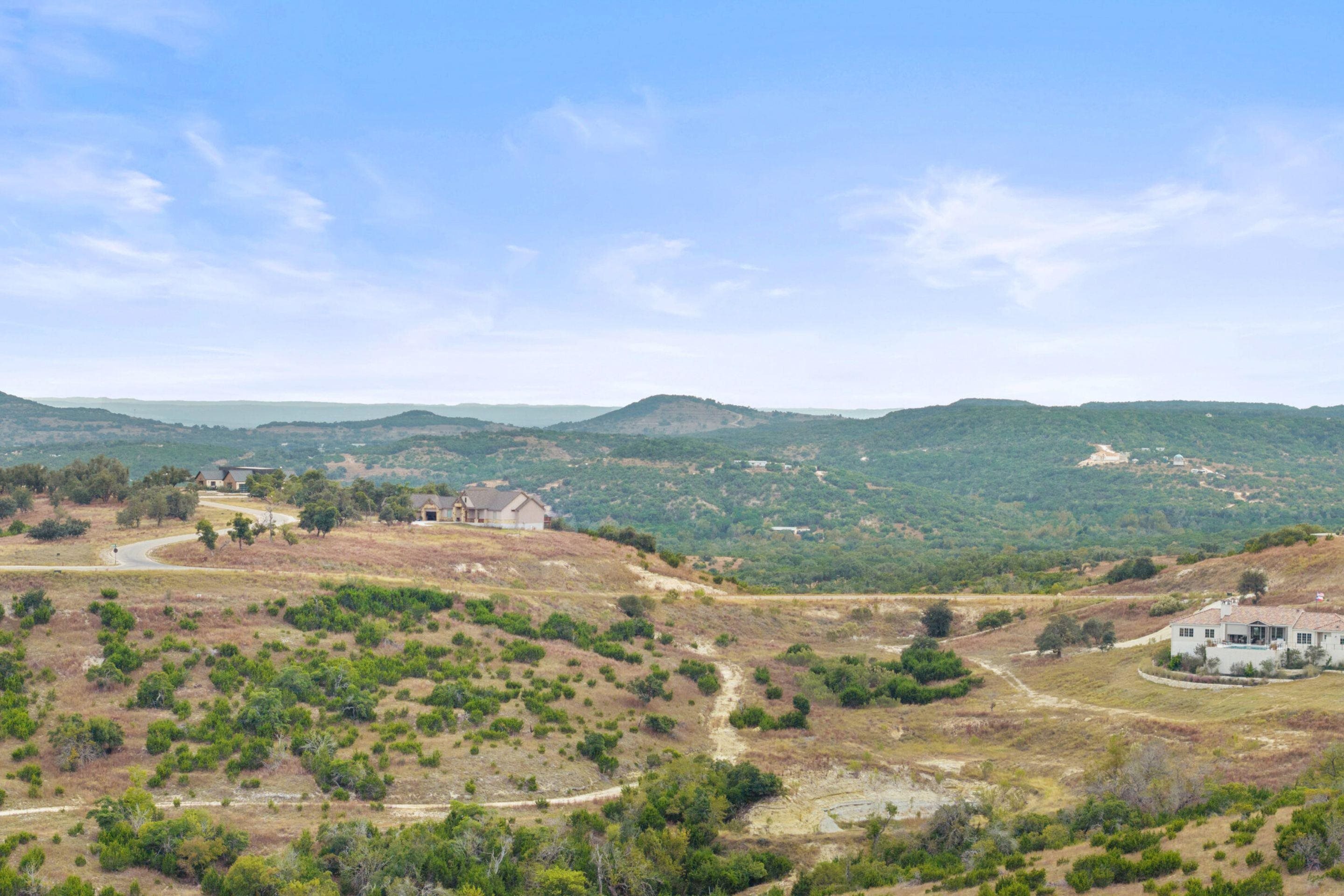 Lot 112 Star Point Circle Blanco, TX 78606 - Photo 3 of 25 a view of a lake with mountains in the background