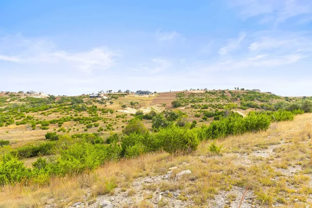a view of lake with green space
