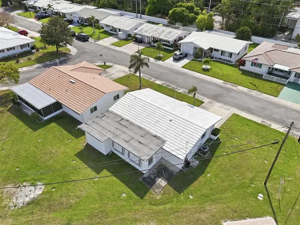 an aerial view of residential houses with outdoor space