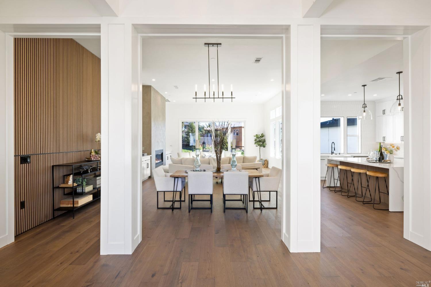 a view of a livingroom with furniture window and wooden floor