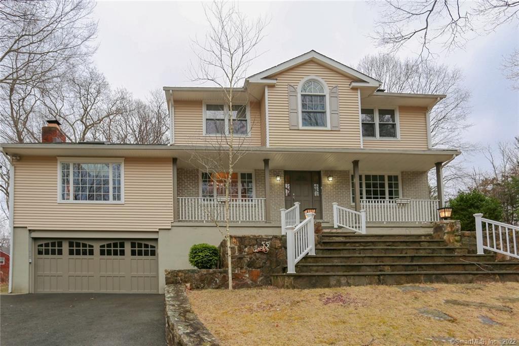 55 Quaker Ridge Road Stamford, CT 06903 - Photo 1 of 1 a front view of a house with a yard