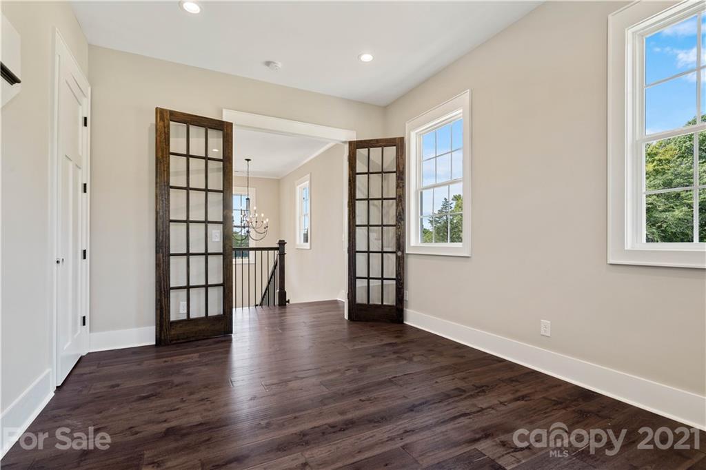 1198 Garvin Road York, SC 29745 - Photo 13 of 34 a view of an empty room with wooden floor and a window