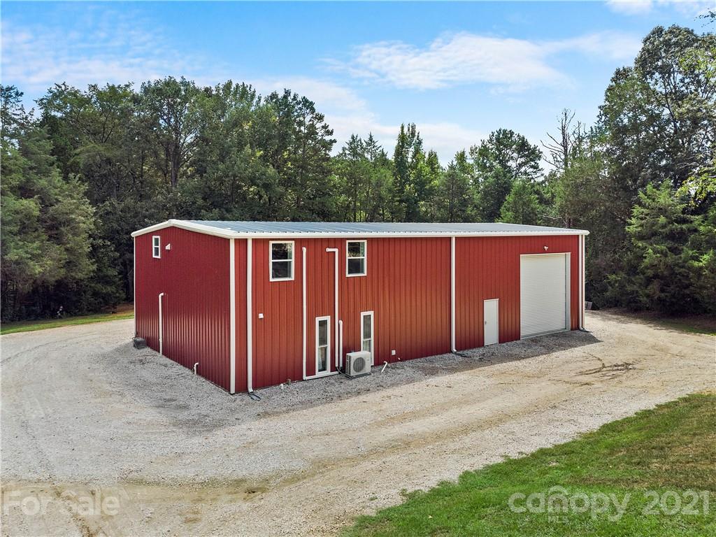 1198 Garvin Road York, SC 29745 - Photo 19 of 34 a view of a barn in the middle of a yard