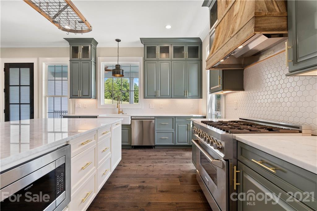 1198 Garvin Road York, SC 29745 - Photo 3 of 34 a kitchen with stainless steel appliances granite countertop a stove a sink and a microwave