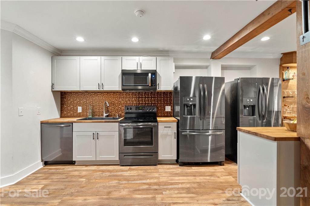 1198 Garvin Road York, SC 29745 - Photo 23 of 34 a kitchen with stainless steel appliances granite countertop a refrigerator stove and sink