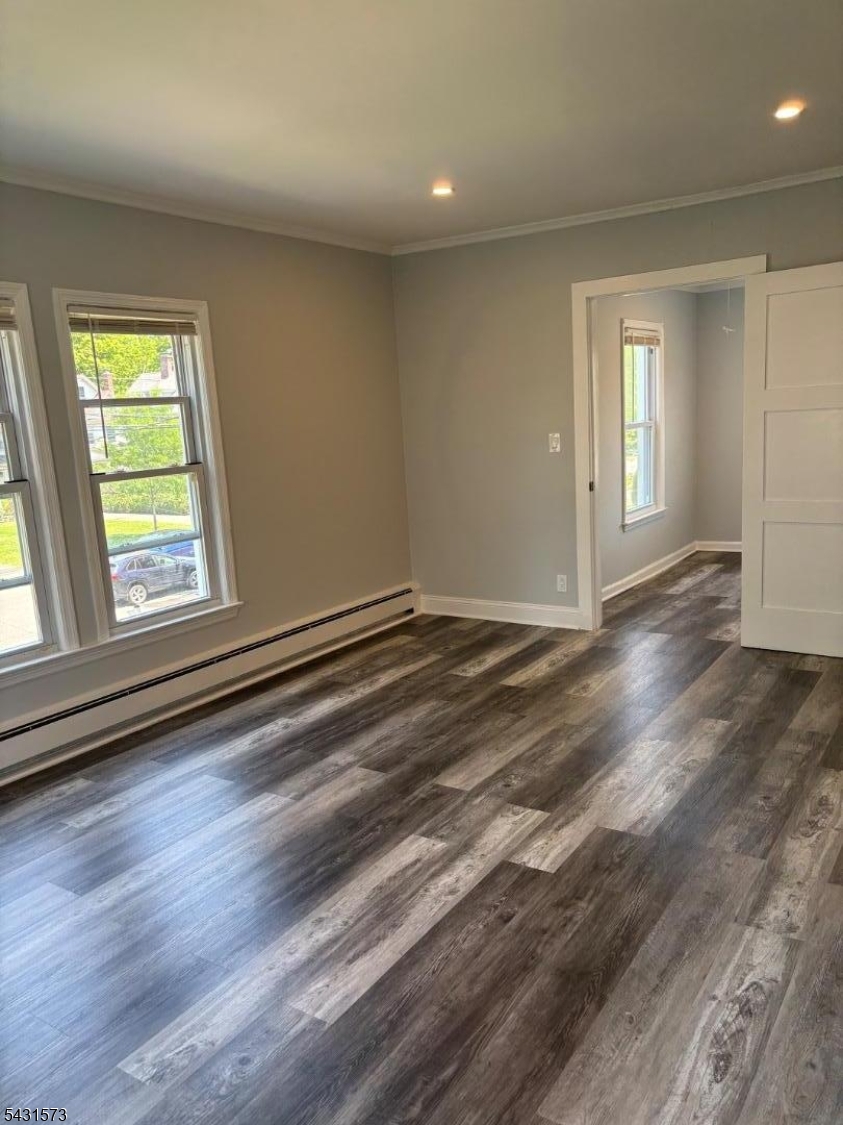 358 Woodland Road, Unit 2 Madison, NJ 07940 - Photo 13 of 50 an empty room with wooden floor and windows