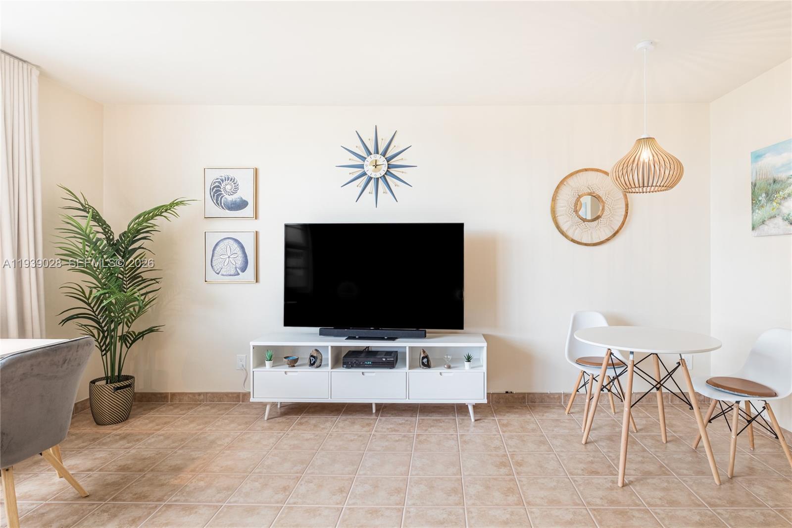 100 Lincoln Road, Unit 431 Miami Beach, FL 33139 - Photo 11 of 34 a living room with furniture and a flat screen tv