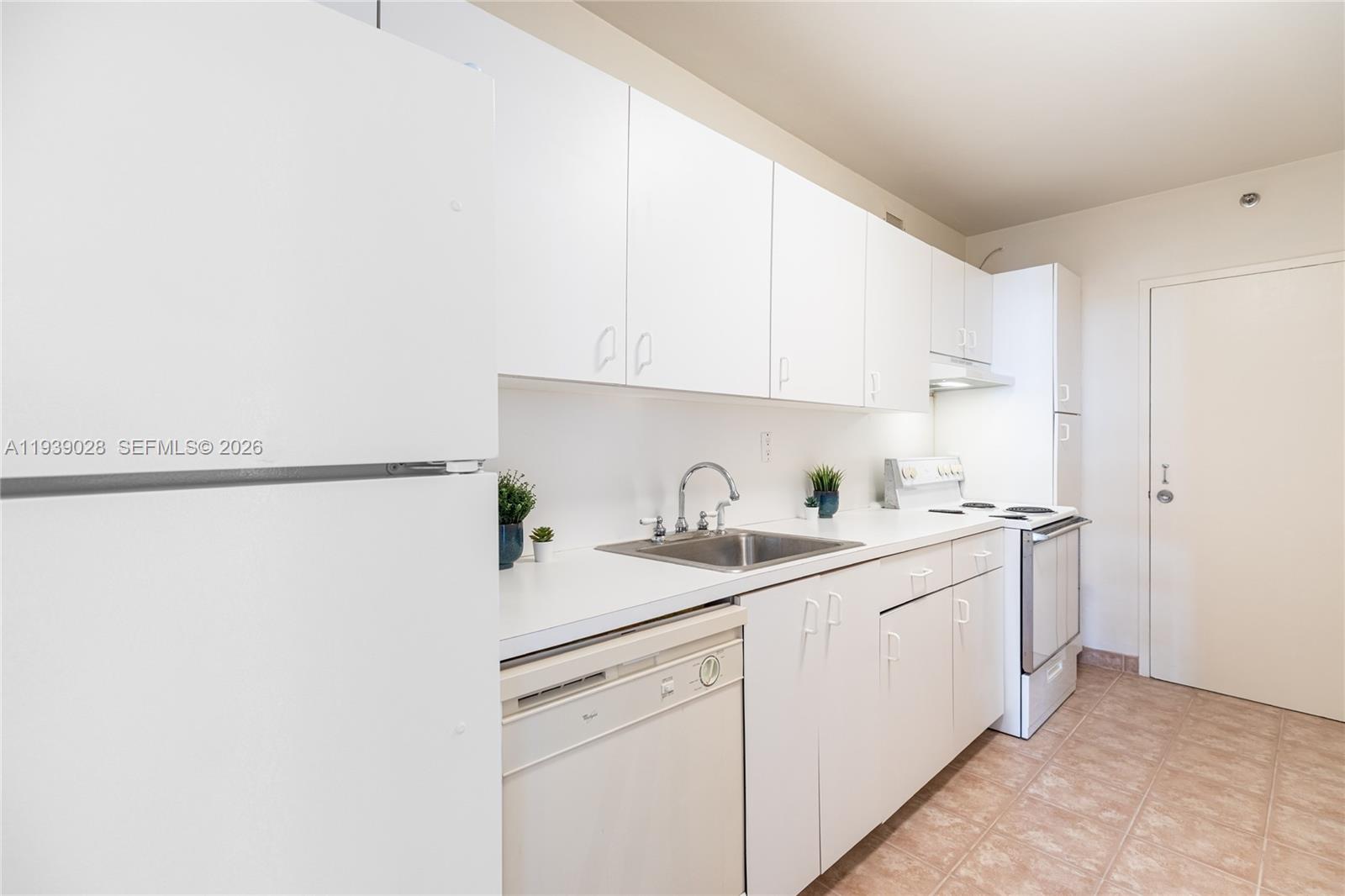 100 Lincoln Road, Unit 431 Miami Beach, FL 33139 - Photo 12 of 34 a kitchen with a sink and cabinets