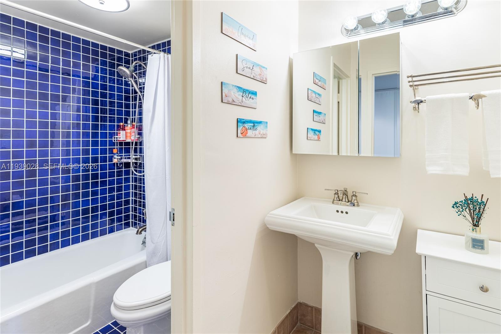 100 Lincoln Road, Unit 431 Miami Beach, FL 33139 - Photo 24 of 34 a bathroom with a sink toilet and shower