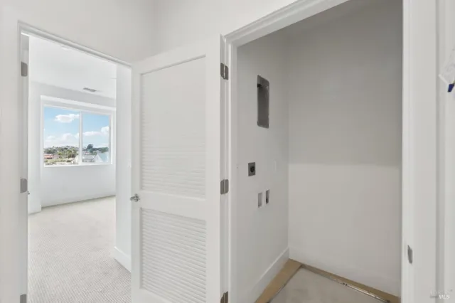 a view of a bathroom from the hallway