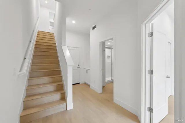 a view of entryway with wooden floor