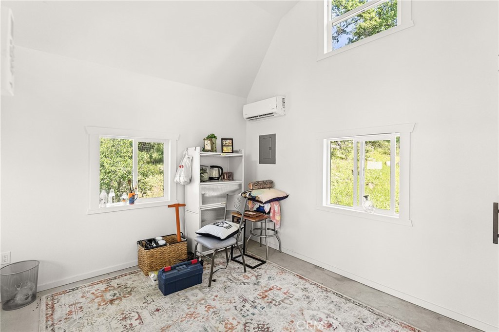 2262 Honey Run Road Chico, CA 95928 - Photo 32 of 74 A detached, fully finished studio offers flexible space for an office, art studio, or guest overflow—complete with a loft, closet, and mini-split system.