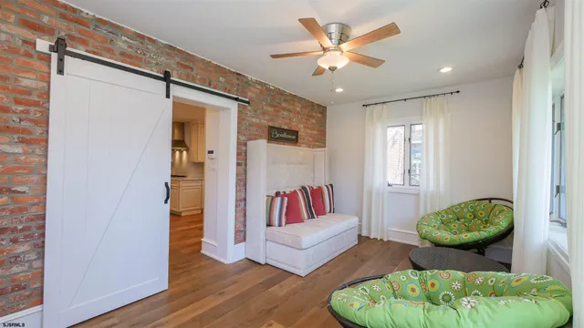 a living room with furniture and a rug