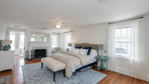 a bed room with a bed and a fireplace