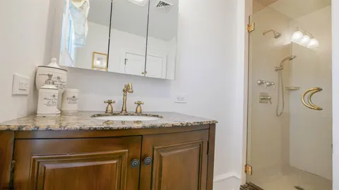 a kitchen with stainless steel appliances granite countertop a sink and a granite counter tops