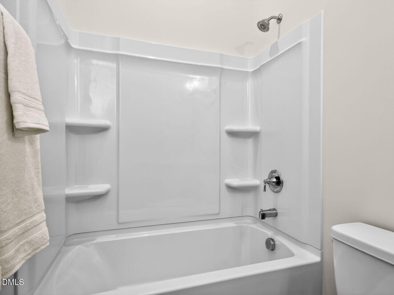 6044 Scalybark Road Durham, NC 27712 - Photo 11 of 39 a bathroom with a bathtub and a toilet