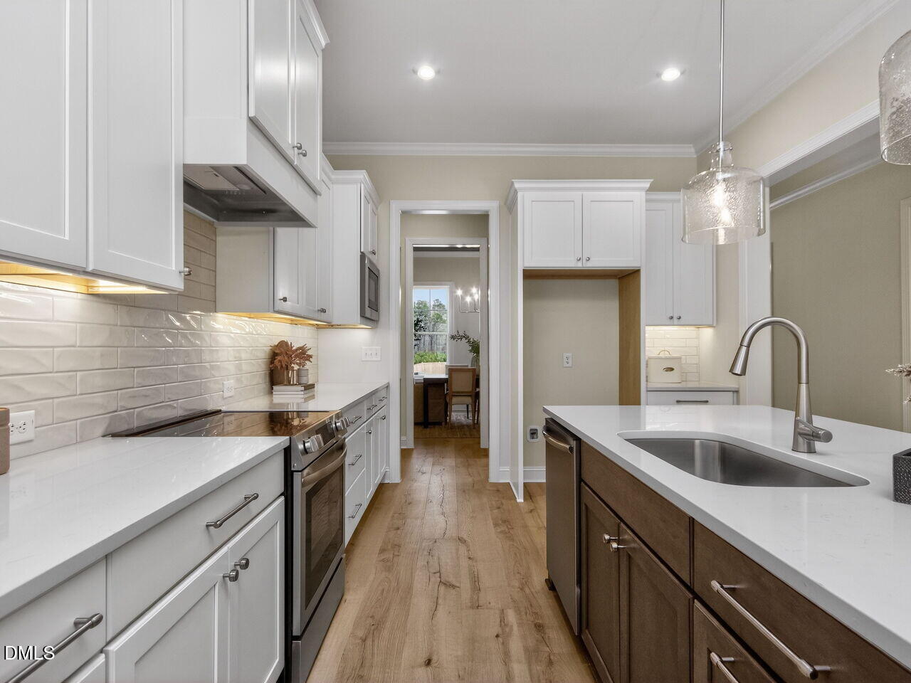 6044 Scalybark Road Durham, NC 27712 - Photo 17 of 39 a kitchen with a sink stove and cabinets