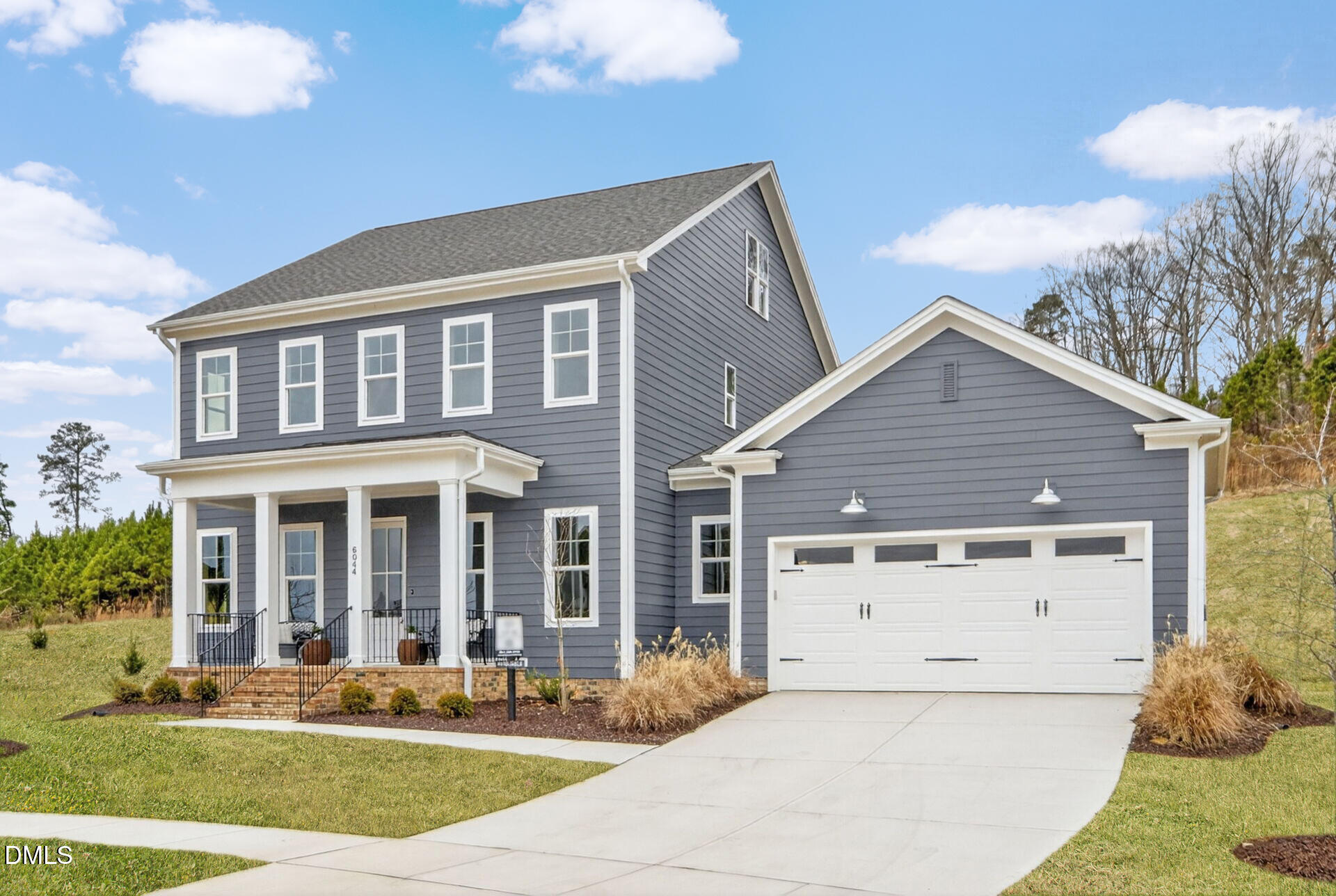 6044 Scalybark Road Durham, NC 27712 - Photo 2 of 39 a view of a house with a yard and plants