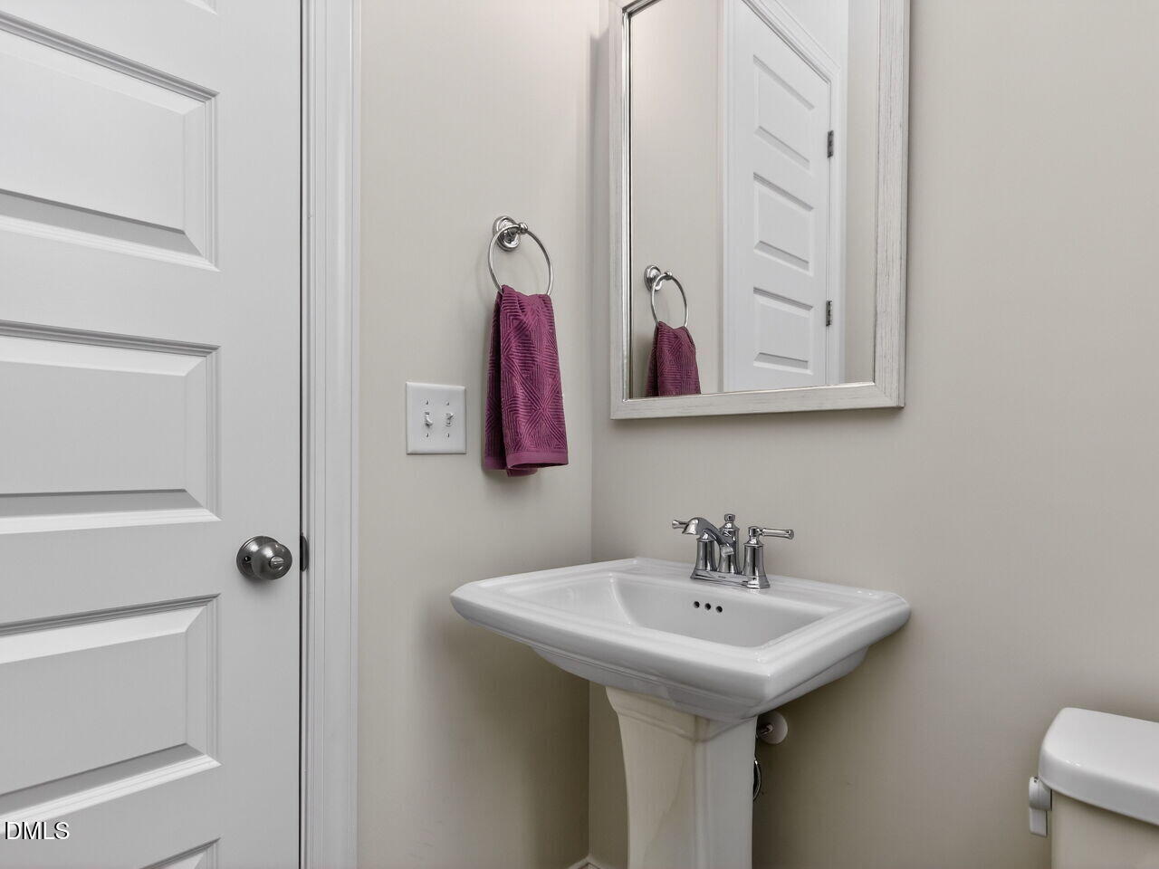 6044 Scalybark Road Durham, NC 27712 - Photo 21 of 39 a bathroom with a sink and a mirror