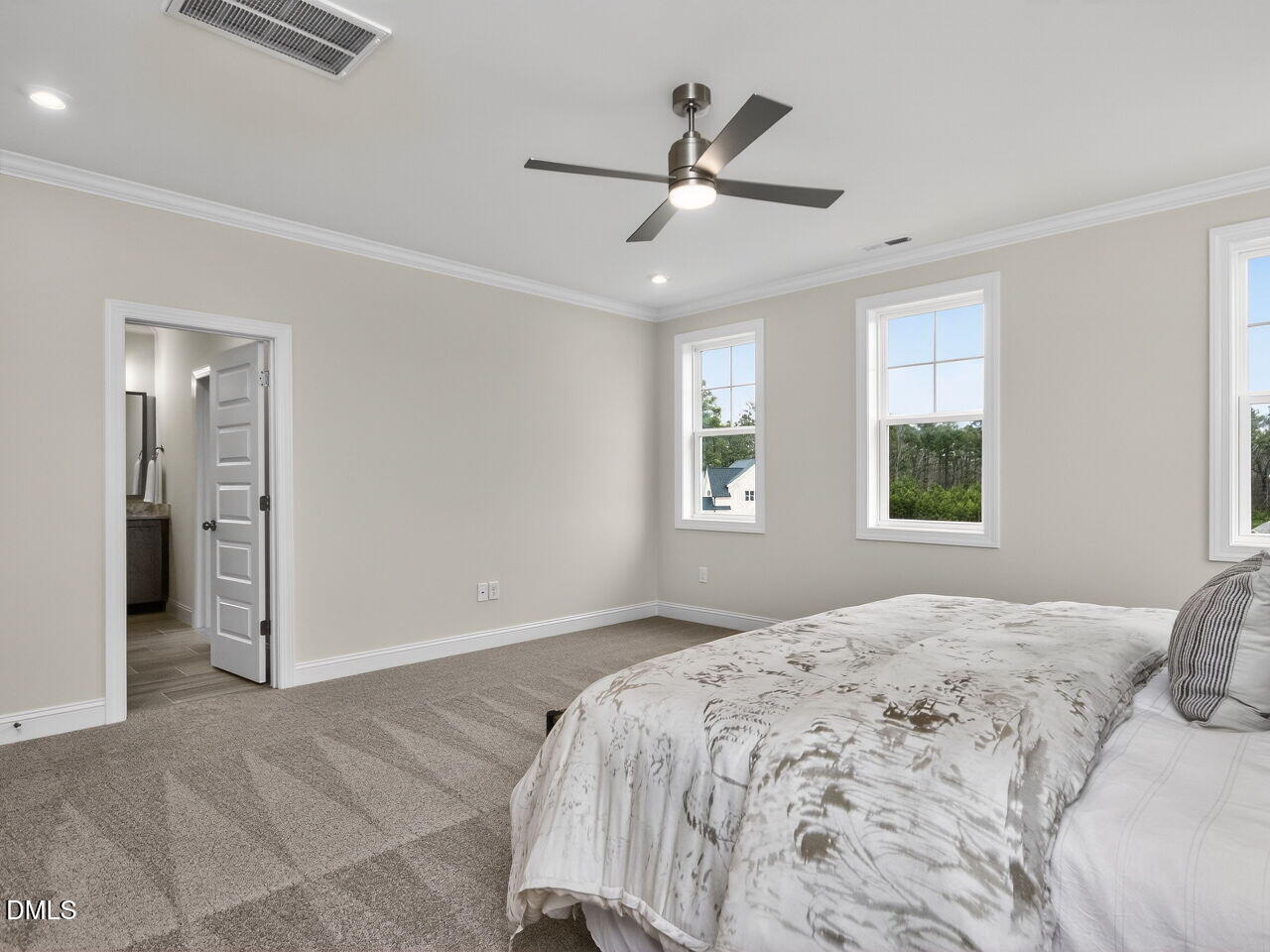 6044 Scalybark Road Durham, NC 27712 - Photo 24 of 39 a bedroom with a large bed and a window