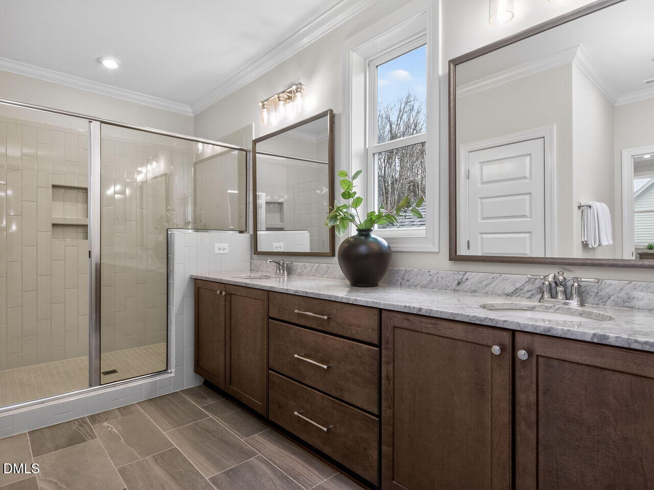 6044 Scalybark Road Durham, NC 27712 - Photo 26 of 39 a bathroom with double sink and shower
