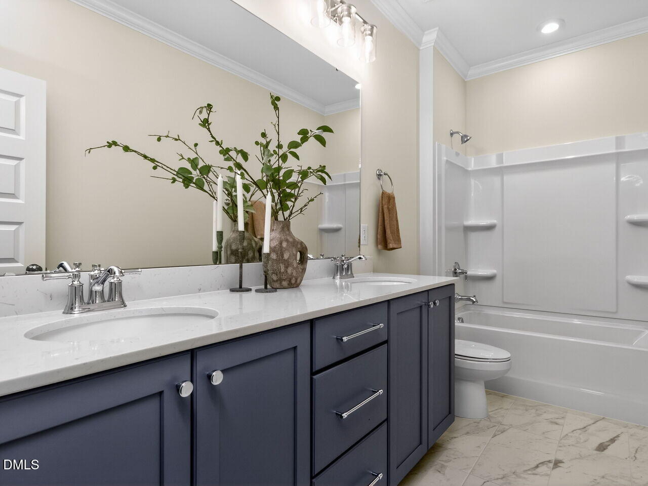 6044 Scalybark Road Durham, NC 27712 - Photo 31 of 39 a bathroom with a granite countertop sink a toilet and a large mirror
