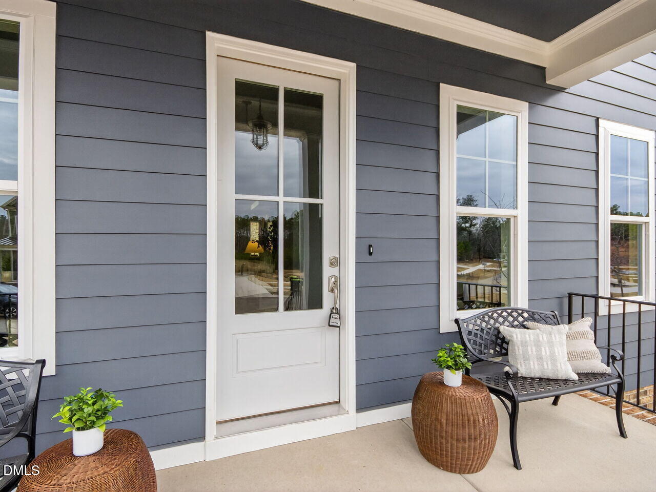 6044 Scalybark Road Durham, NC 27712 - Photo 4 of 39 a view of a chair and table in front of house