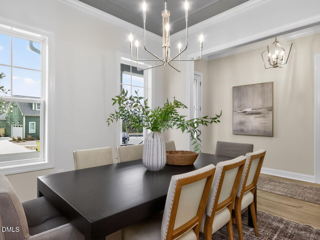 6044 Scalybark Road Durham, NC 27712 - Photo 6 of 39 a view of a dining room with furniture and a chandelier