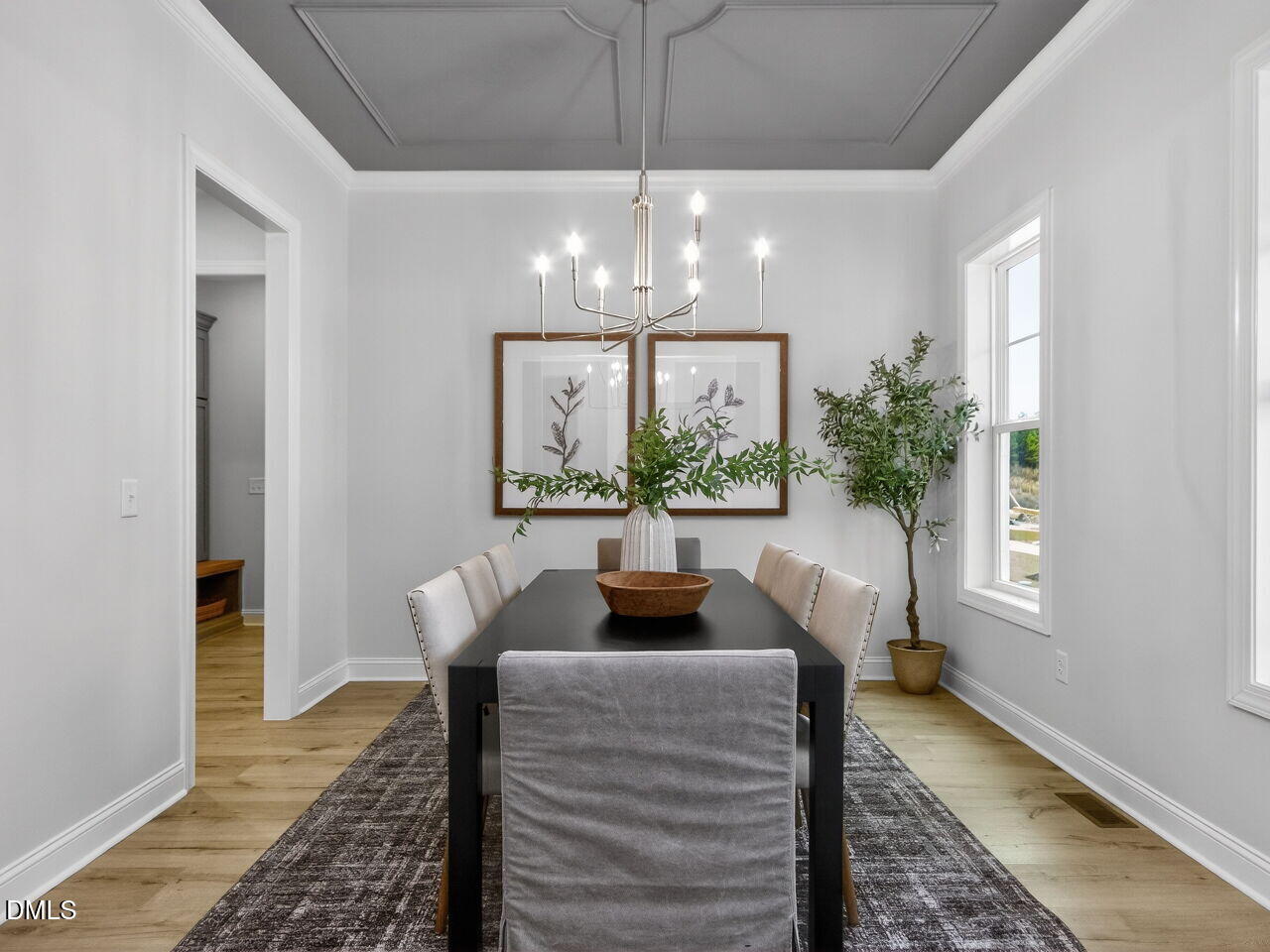 6044 Scalybark Road Durham, NC 27712 - Photo 7 of 39 a living room with furniture and a chandelier