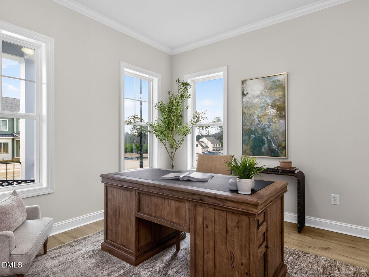 6044 Scalybark Road Durham, NC 27712 - Photo 8 of 39 a room with granite countertop furniture and potted plant