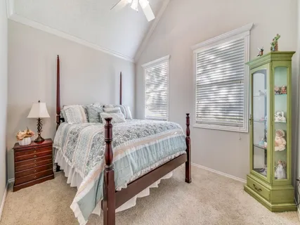 a bedroom with a bed and a cabinets