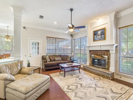 a living room with furniture and a fireplace