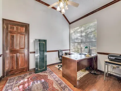 a workspace with furniture and window