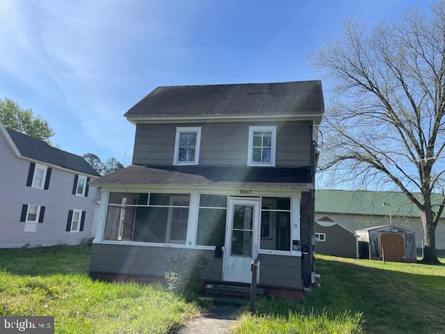 front view of a house with a yard