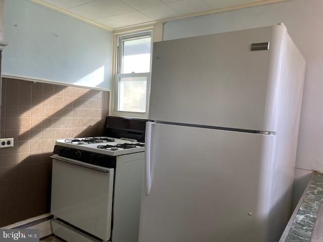 30663 Imaginary Lane Princess Anne, MD 21853 - Photo 7 of 16 a kitchen with a stove and a refrigerator