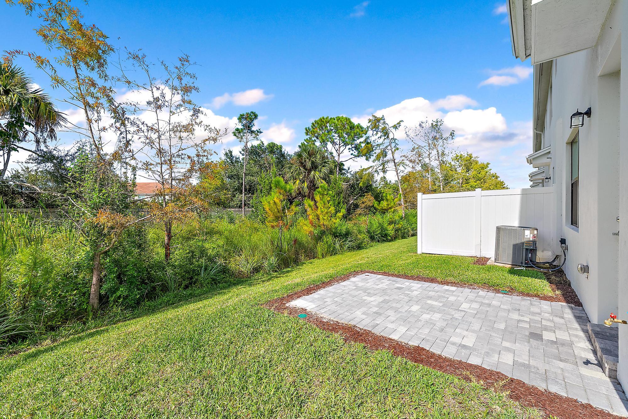 501 Southwest Sally Way Stuart, FL 34997 - Photo 14 of 55 a view of a back yard of the house