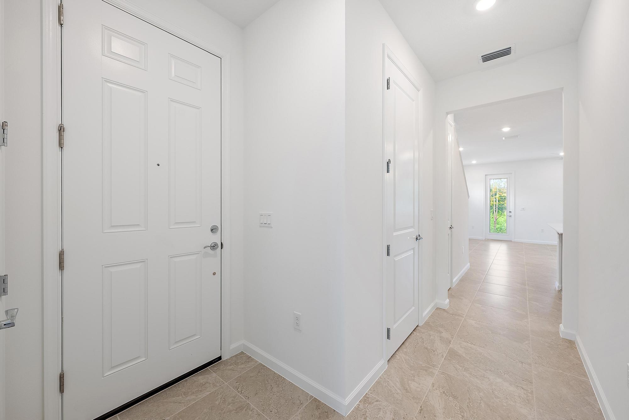 501 Southwest Sally Way Stuart, FL 34997 - Photo 19 of 55 a view of a hallway with wooden floors