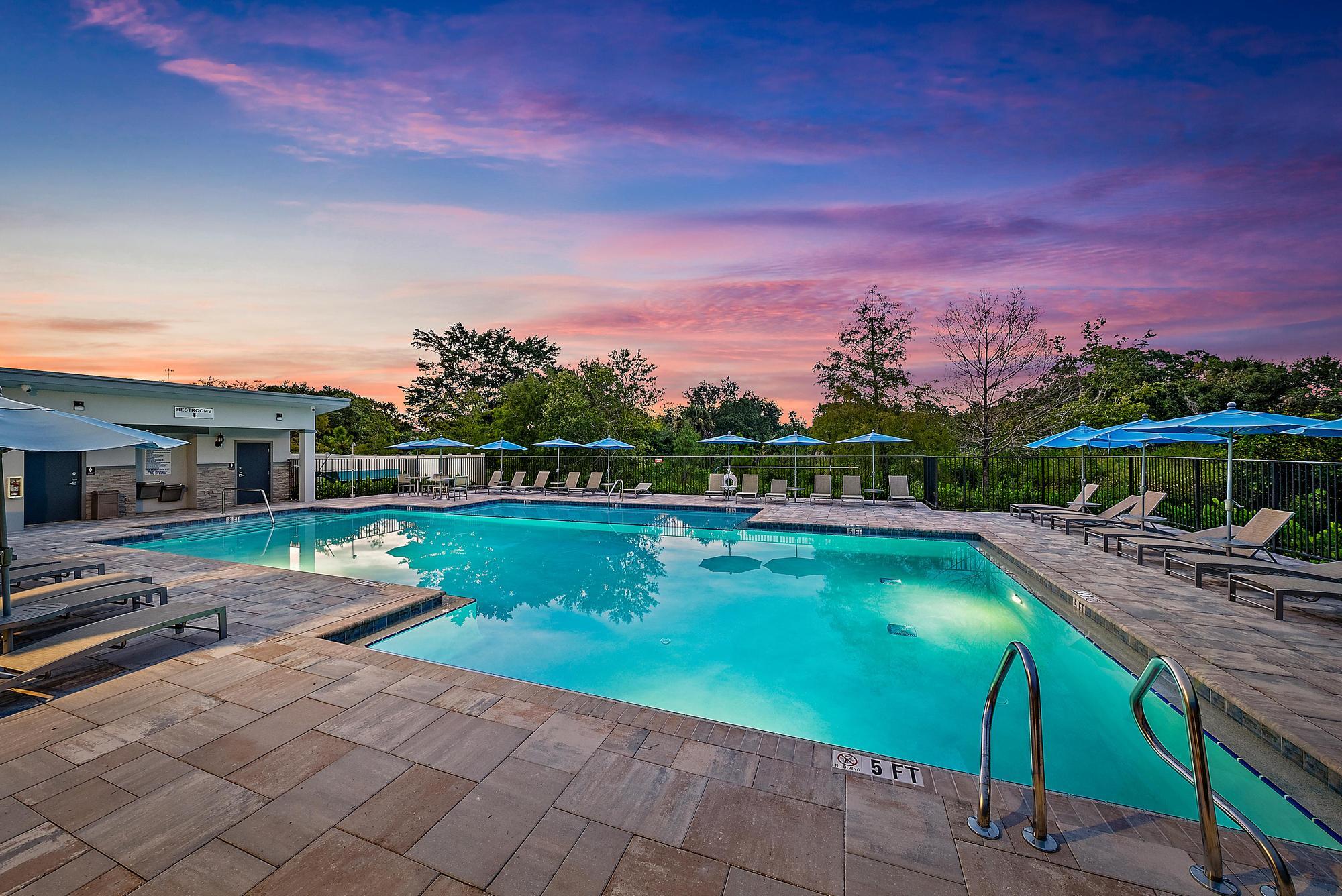 501 Southwest Sally Way Stuart, FL 34997 - Photo 3 of 55 a view of a swimming pool with a patio