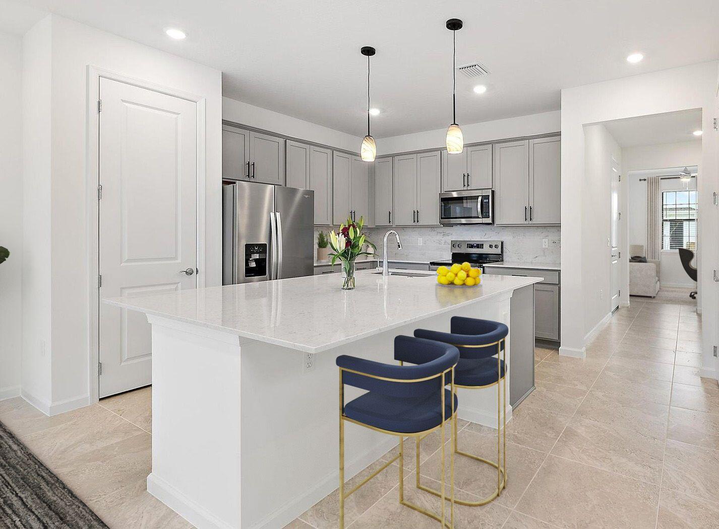 501 Southwest Sally Way Stuart, FL 34997 - Photo 4 of 55 a kitchen with a sink and chairs