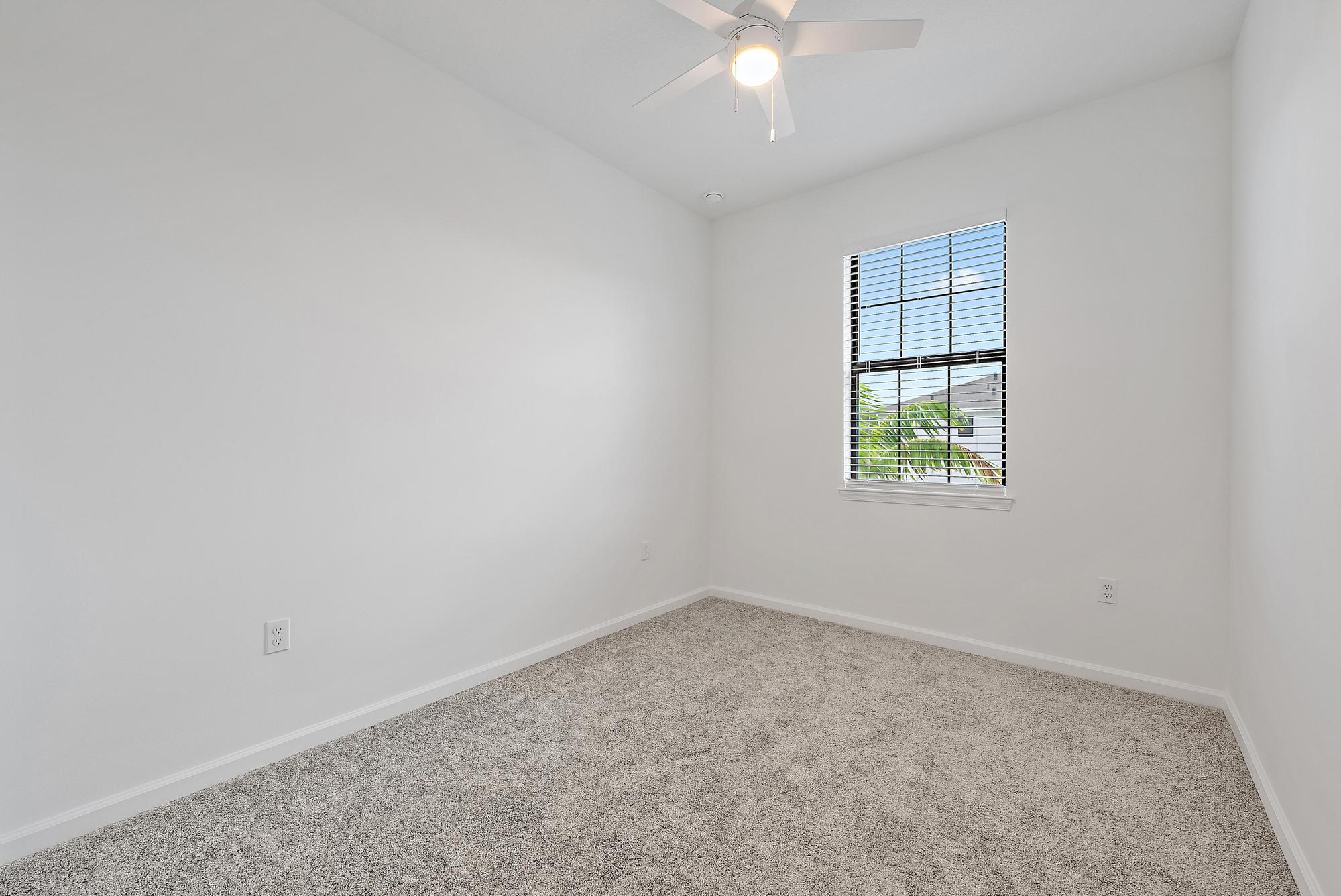 501 Southwest Sally Way Stuart, FL 34997 - Photo 42 of 55 an empty room with windows and fan