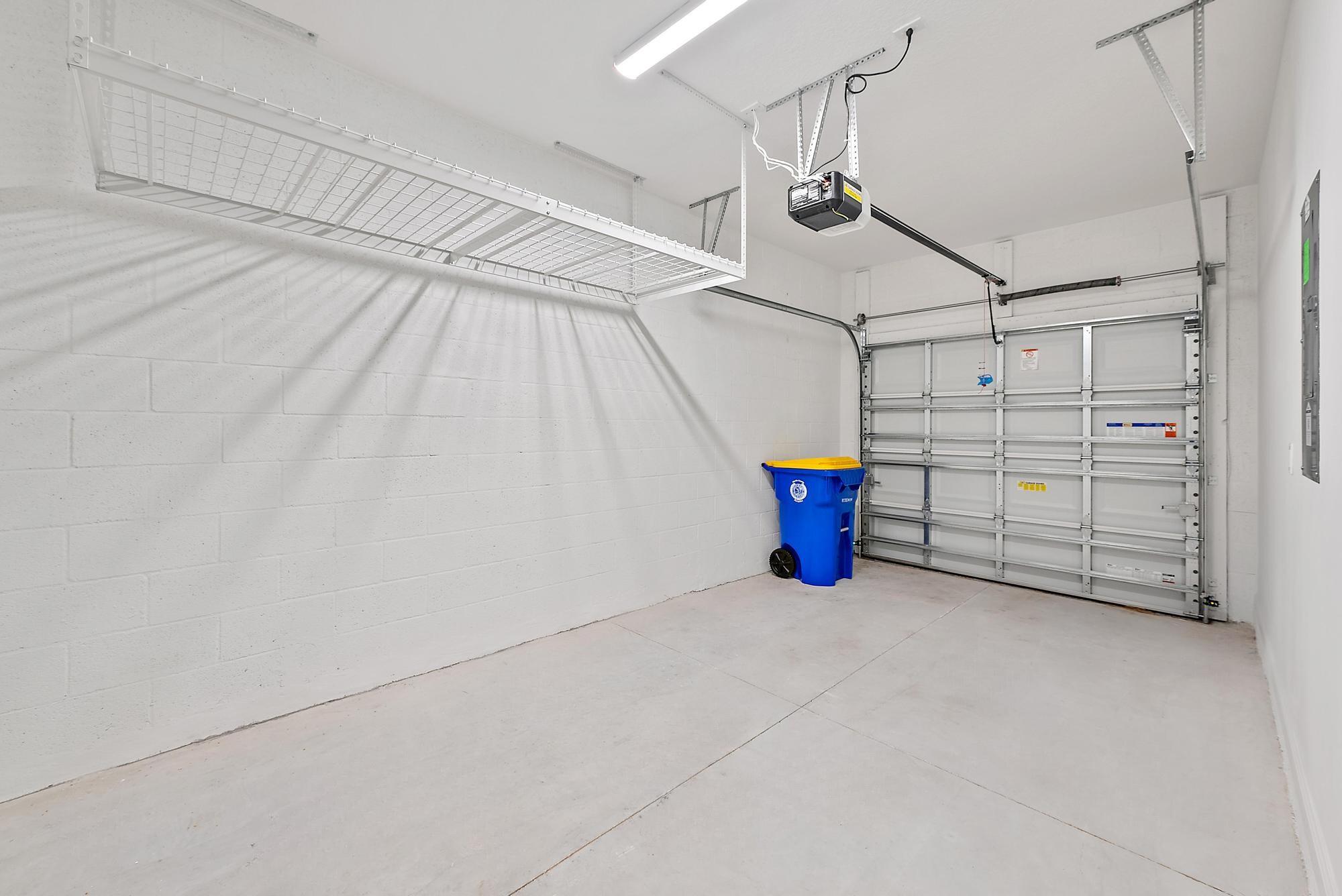 501 Southwest Sally Way Stuart, FL 34997 - Photo 46 of 55 a view of a garage with storage