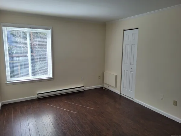 an empty room with closet area