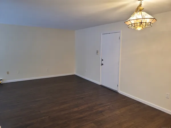 a kitchen with stainless steel appliances a stove microwave and refrigerator
